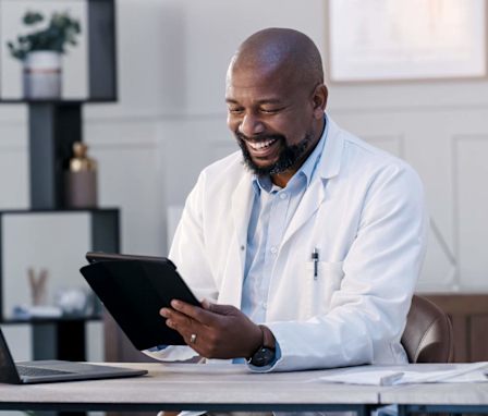 Health informatics professional working in an office