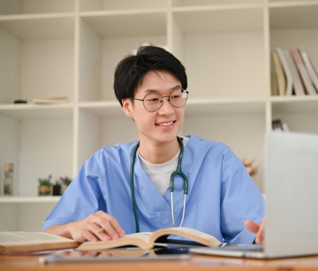 Nurse working on a laptop in the library